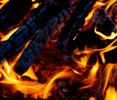 flames of fire on charcoal as backgroundの写真素材