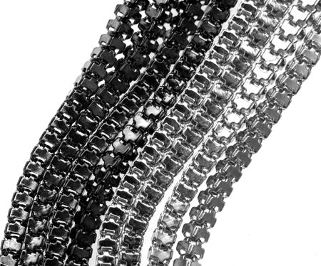 braided silver chain on white backgroundの写真素材