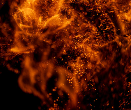fire flame with sparks on black backgroundの写真素材