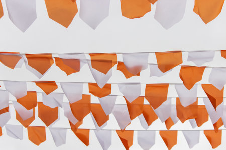 white and orange flags on a white backgroundの写真素材