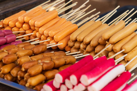 different foods on a stick for frying as a background