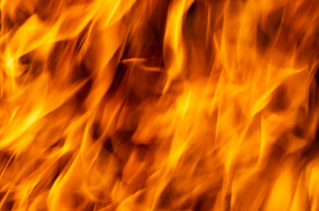flames of fire on charcoal as backgroundの写真素材