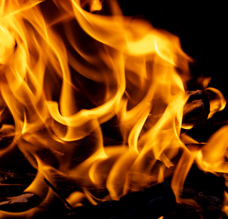 flames of fire on charcoal as backgroundの写真素材
