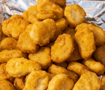 fried chicken nuggets as backgroundの写真素材