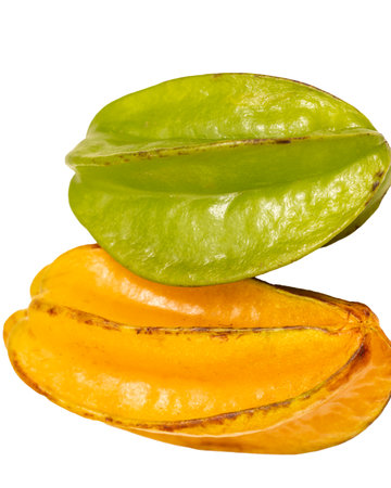 Two green and orange star fruits are shown side by side. The fruit is ripe and ready to eatの写真素材