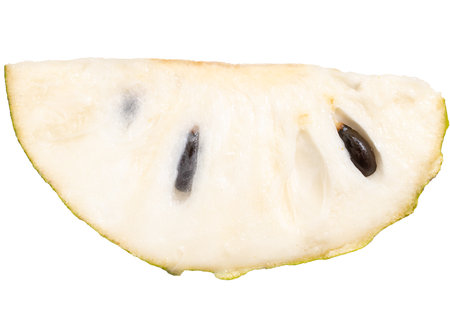 A slice of fruit with a hole in the middle. The fruit is white and has a green stemの写真素材