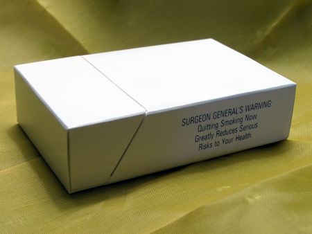 Blank cigarette pack on fabric background.の写真素材