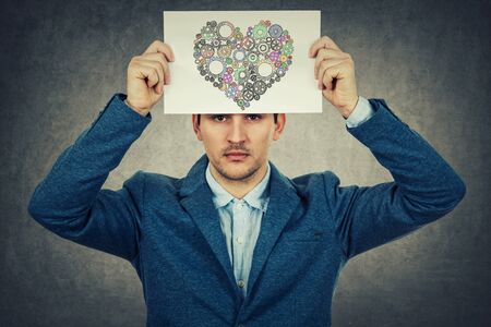 Mental state of human having depression with a drawing heart made from gears losing her color.の写真素材