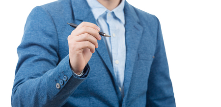 Business man holding a pen on white background.Businessman writing.の写真素材