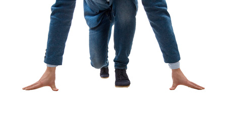 Determined young businessman kneeling at a start line. Business Challenge isolated on white.の写真素材