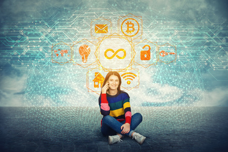 Woman student talking to phone. Modern world entertainment and business computer technology services. Infinite digital interface, limitless access to features realistic hologram.の写真素材