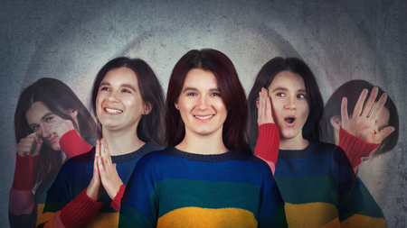 Young woman suffer split emotions into five different inner personalities. Multipolar mental health...