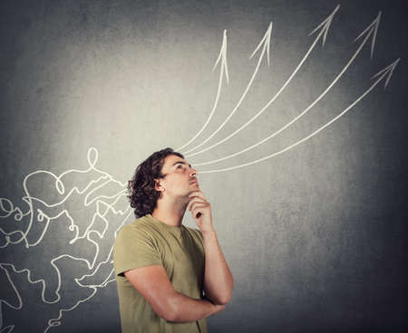 Intelligent man processing information coming from outside like a mess through his head and...