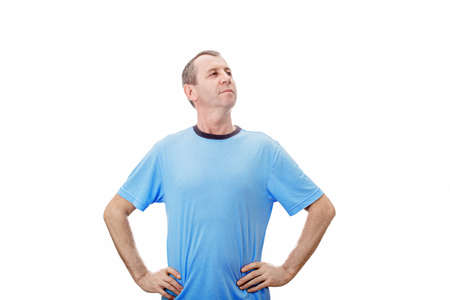 Middle aged man with hands on hips showing chest and power like a superhero isolated over white...