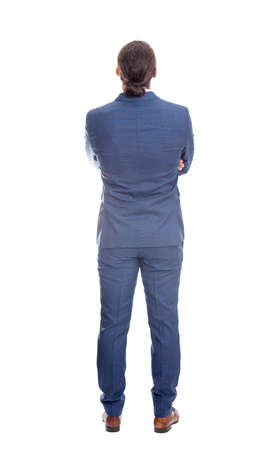 Rear view businessman in suit keeps arms crossed. Full length person isolated on white background. Backside business male bodyの写真素材