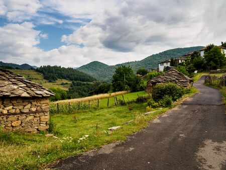 Road in a old mountain village in Bulgaria. Stone houses and wooden fences. Rhodope mountain.の写真素材