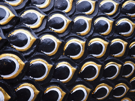 Sculpture of black serpent or dragon scales texture background