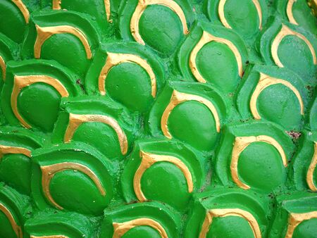 Sculpture of green serpent or dragon scales texture backgroundの写真素材