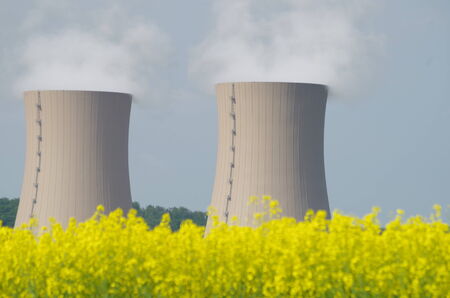 A rapeseed field in front of the Atonkraftwerk Grohndeの写真素材