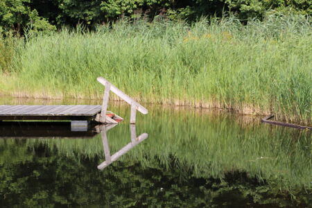 A lake with a boardwalkの写真素材