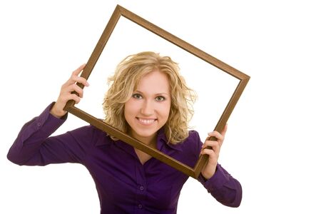 Blonde woman looking through an empty frameの写真素材