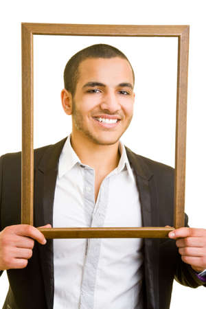 Business man looking through an empty frameの写真素材