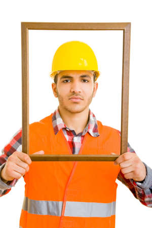 Construction worker looking through an empty frameの写真素材