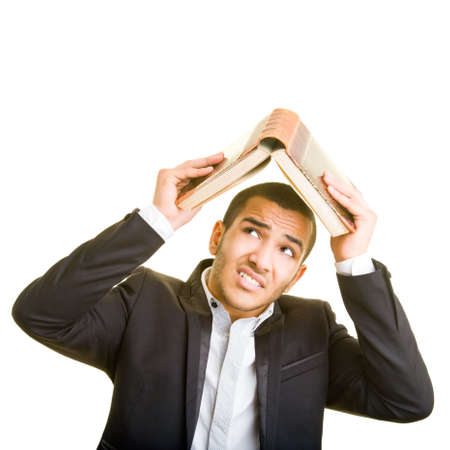 Manager covering his head with an open bookの写真素材