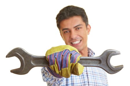 Happy worker showing a jaw wrenchの写真素材