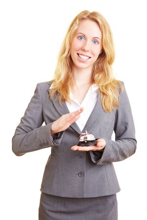 Woman in a business suit with hotel bell