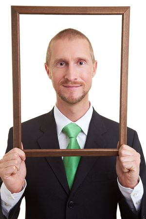 Manger holding empty frame in front of faceの写真素材