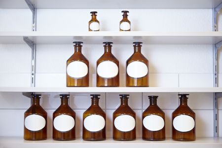 Eleven drug bottles in a pharmacy labの写真素材