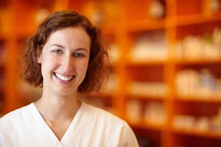 Portrait of a smiling pharmacist in pharmacyの写真素材