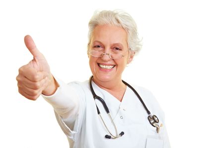 Happy female doctor holding her thumb upの写真素材