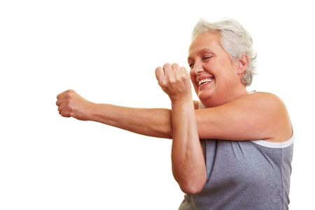 A happy senior woman doing fitness exercisesの写真素材