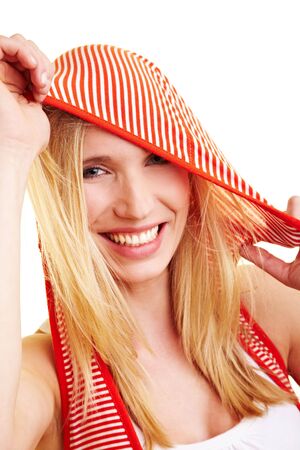 Young blonde woman with a striped hoodyの写真素材