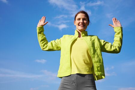 Young woman doing some fitness exercises outdoors