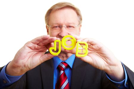 Senior businessman holding letters forming the word JOB