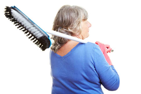 Retired woman carrying a scubber over her shoulderの写真素材