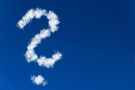 Question mark made of clouds in a blue skyの写真素材
