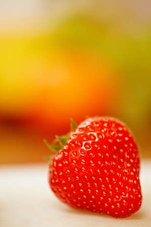 Perfect red strawberry on a cutting board in a kitchenの写真素材
