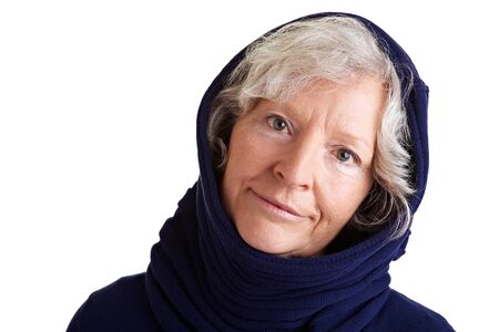 Senior woman with scarf and hoody in winterの写真素材