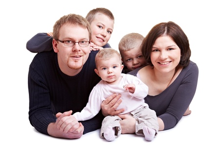 Happy family with father and mother and three children including babyの写真素材