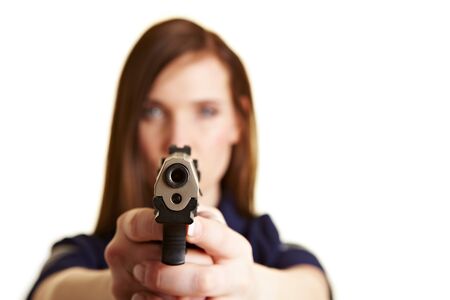 Outlet of a pistol being held by a police womanの写真素材
