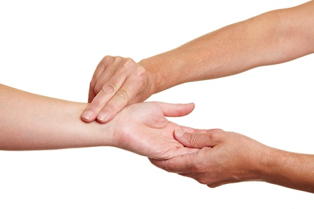 Hands measuring blood preasure with fingers at wristの写真素材