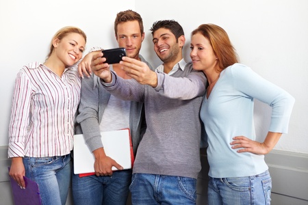 Teenager friends looking together at a smartphone