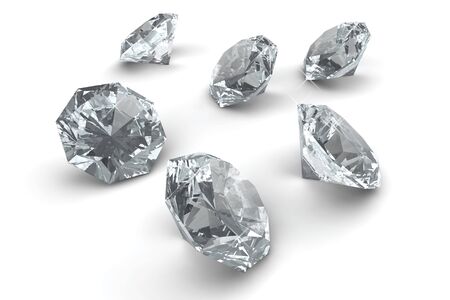 Many sparkling diamonds laying on white floorの写真素材