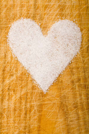 Heard made of sugar on a wooden cutting boardの写真素材