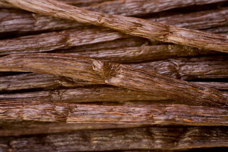Closeup of many bourbon vanilla pods on a pileの写真素材