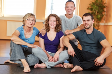 Portrait of men and women sitting in a health clubの写真素材